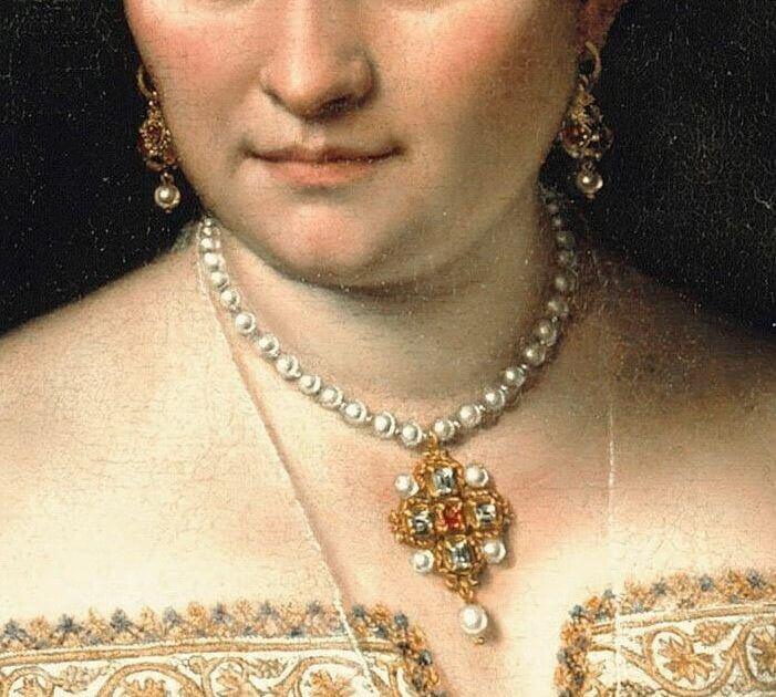 a close up of a painting of a woman with a large pearl necklace and earrings on