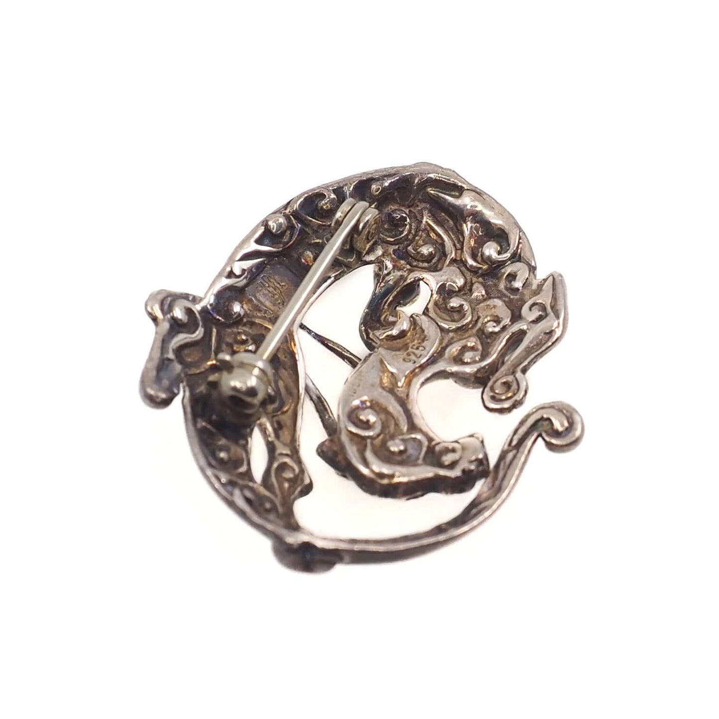 The back of a Sleeping Dragon Animal Figural Sterling Silver Brooch