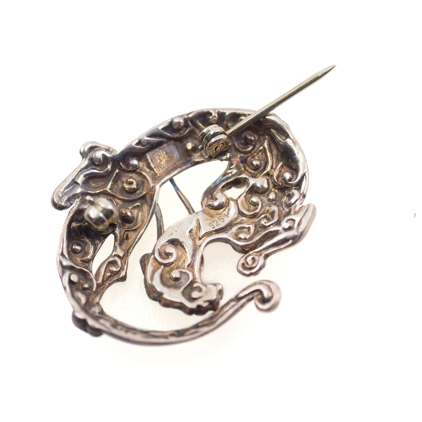 The back of a Sleeping Dragon Animal Figural Sterling Silver Brooch