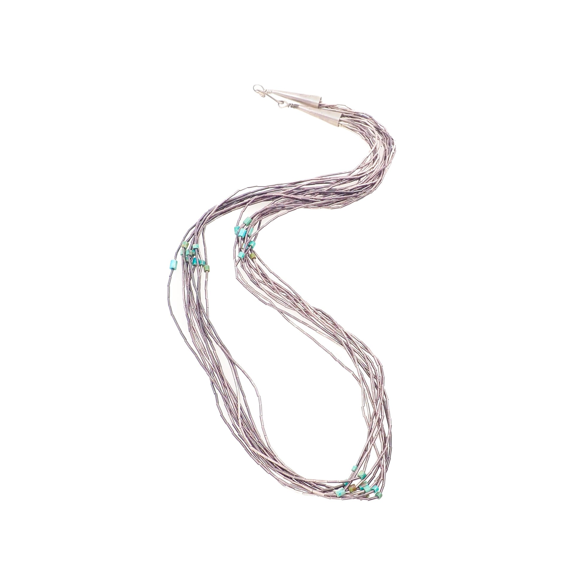 A vintage 1970s sterling silver and blue turquoise bead liquid silver necklace with multiple strands.