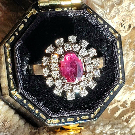 large ruby and diamond double halo ring in a black box