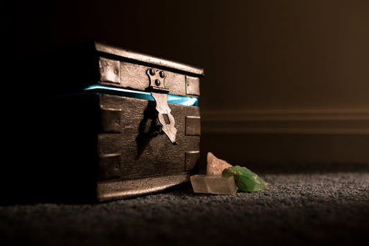 A large wooden chest with a glowing green light on the inside