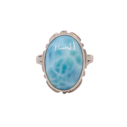 large blue gemstone in silver ring