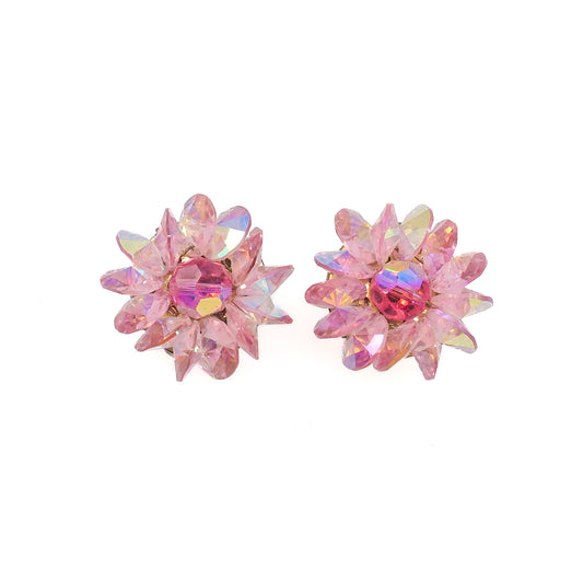 Pair of pink crystal stud earrings on a white background