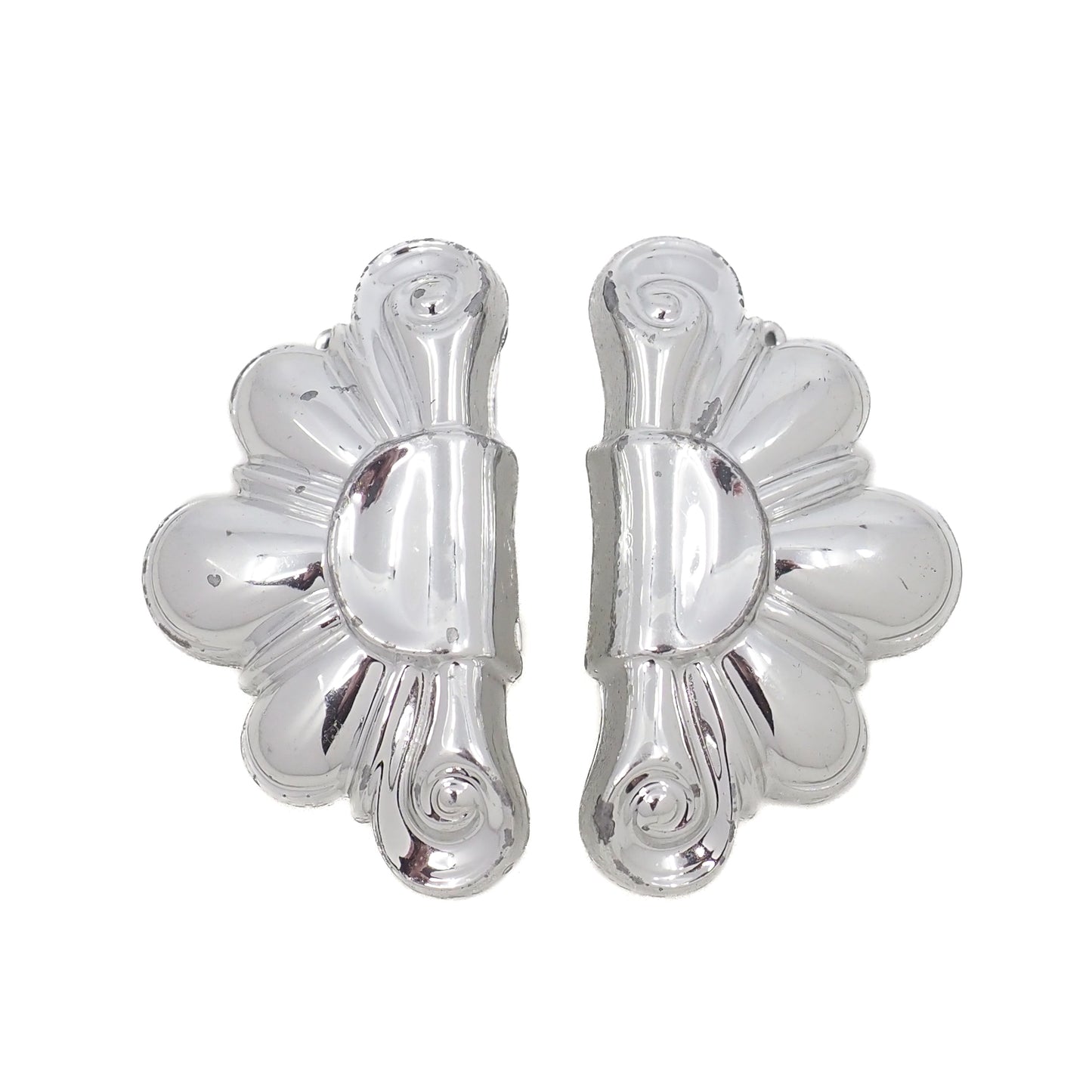 Pair of silver floral earrings on a white background