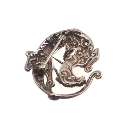 The back of a Sleeping Dragon Animal Figural Sterling Silver Brooch